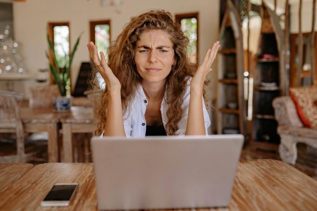 Frustrated woman on a laptop